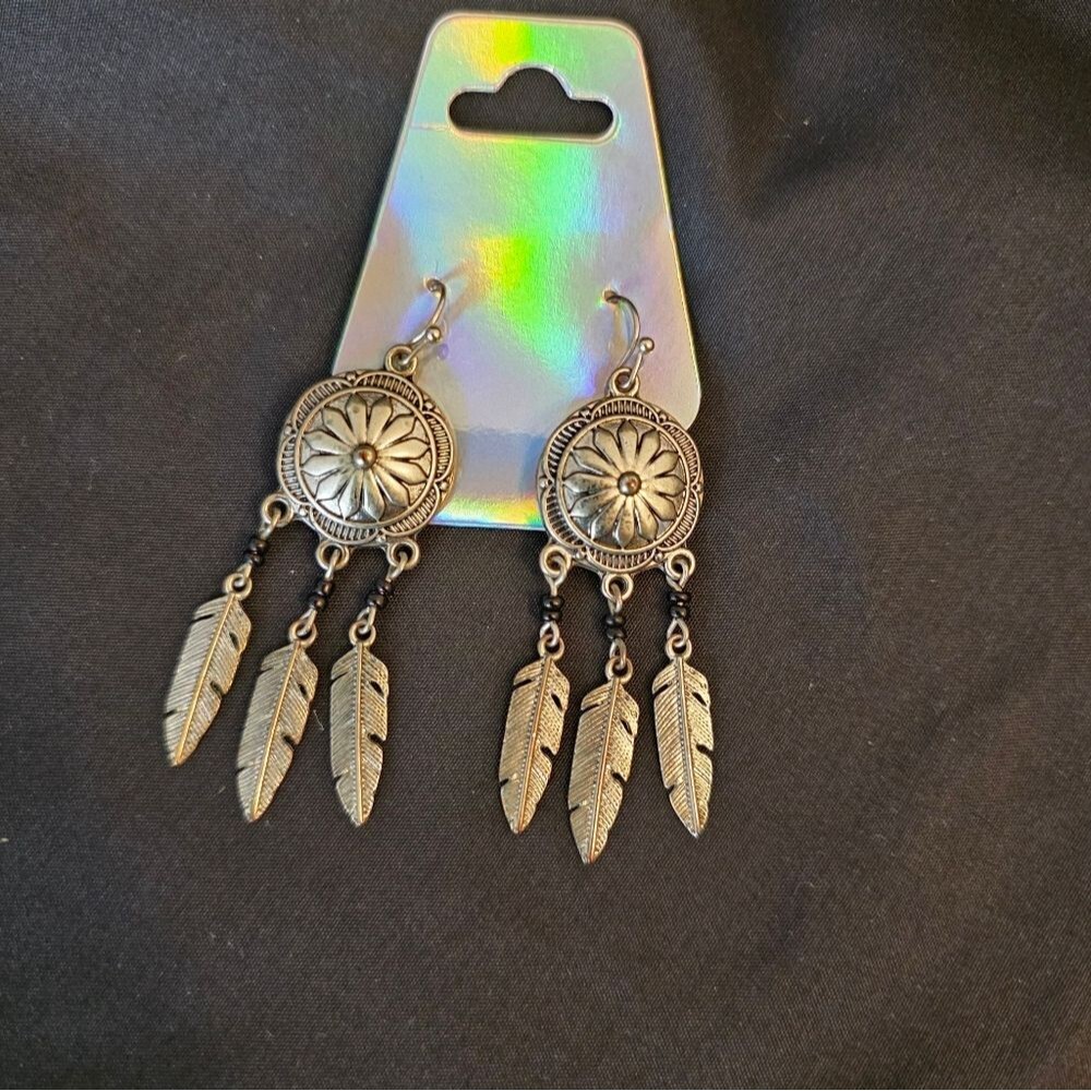 Silver-tone concho and feather dangle earrings